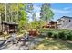 Picturesque backyard with a fire pit area, outbuilding, and lush landscaping at 363 Ridge Run Dr, Hiram, GA 30141