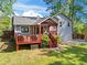 The home's backyard features a red wooden deck, a cozy covered patio area, and well-maintained green spaces at 363 Ridge Run Dr, Hiram, GA 30141