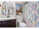 Bright bathroom featuring a desert-themed shower curtain and cactus wall art at 363 Ridge Run Dr, Hiram, GA 30141