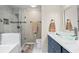 Beautifully tiled bathroom with glass enclosed shower and modern vanity at 363 Ridge Run Dr, Hiram, GA 30141