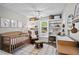 Charming Bedroom with a crib, rocker, and decorative wall art and shelving at 363 Ridge Run Dr, Hiram, GA 30141