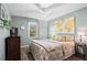 Cozy bedroom with a large world map print above the bed and a ceiling fan at 363 Ridge Run Dr, Hiram, GA 30141