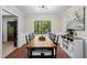 Dining room with a large window and modern chandelier is ideal for formal dinners and casual Gathering gatherings at 363 Ridge Run Dr, Hiram, GA 30141