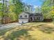 Beautiful well-maintained home with a spacious front yard, two-car garage, and inviting front porch with an American flag at 363 Ridge Run Dr, Hiram, GA 30141