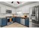 Well-lit kitchen with stainless steel appliances and updated cabinetry at 363 Ridge Run Dr, Hiram, GA 30141