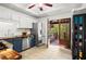 Bright kitchen with deck access featuring stainless appliances and tiled floor at 363 Ridge Run Dr, Hiram, GA 30141