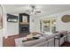Bright living room with a stone fireplace, ceiling fan, and natural light that offers a comfortable and inviting atmosphere at 363 Ridge Run Dr, Hiram, GA 30141