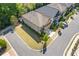 Aerial view of the property highlighting the roof, landscaping, and location within the neighborhood at 3715 Lexington Rd, Tucker, GA 30084