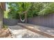 Relaxing backyard featuring a hammock under a pergola, set on a deck surrounded by gravel at 3715 Lexington Rd, Tucker, GA 30084
