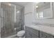 Bathroom features a glass enclosed shower with gray toned tile, gray vanity and granite countertops at 3715 Lexington Rd, Tucker, GA 30084