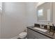 A compact half bathroom features a granite countertop and vanity at 3715 Lexington Rd, Tucker, GA 30084
