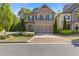 Charming brick home with a well-manicured lawn and two-car garage and stone driveway at 3715 Lexington Rd, Tucker, GA 30084