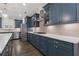 Spacious kitchen with stainless steel appliances, subway tile backsplash, and blue cabinets at 3715 Lexington Rd, Tucker, GA 30084