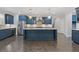 Open kitchen with a large island, stainless steel appliances, and hardwood floors at 3715 Lexington Rd, Tucker, GA 30084