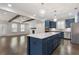 Open kitchen featuring a large island, stainless steel appliances and views to the living room at 3715 Lexington Rd, Tucker, GA 30084