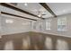 Spacious living room featuring wood beams and large windows for natural light at 3715 Lexington Rd, Tucker, GA 30084