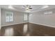 Spacious main bedroom with hardwood floors, recessed lighting, ceiling fan, and shuttered windows at 3715 Lexington Rd, Tucker, GA 30084
