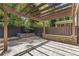 Outdoor patio showcasing a decorative stone wall and pergola providing shade and character at 3715 Lexington Rd, Tucker, GA 30084