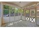 Screened in porch with stone flooring, ceiling fan, and views of the backyard at 3715 Lexington Rd, Tucker, GA 30084
