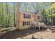 The exterior showcases a quaint porch, well-maintained siding, and classic architecture with mature landscaping at 464 Meadowbrook Dr, Mcdonough, GA 30253
