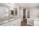 Bright main bathroom with walk-in shower, tub, and granite countertops at 464 Meadowbrook Dr, Mcdonough, GA 30253