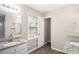 Main bathroom featuring double sinks and granite countertops at 464 Meadowbrook Dr, Mcdonough, GA 30253