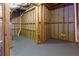 Unfinished basement with wood framing and concrete walls with painted concrete floors at 51 Sagemont Ct, Acworth, GA 30101