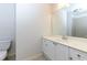 Bright bathroom features a white vanity, tiled floors and shower/bath combo with modern fixtures at 51 Sagemont Ct, Acworth, GA 30101