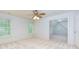 Relax in this light and airy bedroom with large windows, neutral carpet and a ceiling fan at 51 Sagemont Ct, Acworth, GA 30101