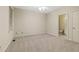 Spacious bedroom featuring neutral carpet, ceiling fan, and adjacent bathroom entrance at 51 Sagemont Ct, Acworth, GA 30101