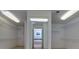 This walk-in closet features wire shelving, neutral carpet and a view into the primary bath at 51 Sagemont Ct, Acworth, GA 30101
