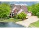 Stunning home with manicured landscaping, a three-car garage, and beautiful architectural details at 51 Sagemont Ct, Acworth, GA 30101