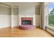 Cozy fireplace with brick hearth and surround in a bright room featuring elegant decor and plenty of natural light at 51 Sagemont Ct, Acworth, GA 30101