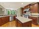 Gourmet kitchen with an island, stainless appliances and dark wood cabinets at 51 Sagemont Ct, Acworth, GA 30101