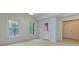 Bright room with hardwood floors, two windows and a door leading outside at 51 Sagemont Ct, Acworth, GA 30101