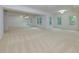 Spacious open room with carpet and multiple large windows offering natural light at 51 Sagemont Ct, Acworth, GA 30101