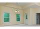Bright living room with windows and a chandelier over the beige carpet at 51 Sagemont Ct, Acworth, GA 30101
