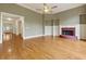Open living room featuring hardwood floors, fireplace, and large entryway for an inviting, spacious feel at 51 Sagemont Ct, Acworth, GA 30101