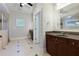 Main bathroom with tiled flooring, dual sink vanities, and tiled shower stall at 51 Sagemont Ct, Acworth, GA 30101
