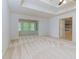 Spacious main bedroom with neutral carpets, tray ceilings, and natural light at 51 Sagemont Ct, Acworth, GA 30101