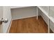 Pantry with white shelving units and wood flooring at 51 Sagemont Ct, Acworth, GA 30101
