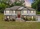 Beautiful two-story home featuring a brick facade, a manicured lawn, and an inviting red front door at 204 Arapahoe Ct, Villa Rica, GA 30180