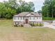 Two-story home boasts stone accents, a well-kept lawn, and a driveway leading to an attached garage at 204 Arapahoe Ct, Villa Rica, GA 30180