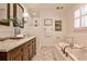Charming bathroom features a double vanity, tiled shower, bathtub and marble floors for spa-like feel at 1362 Briarcliff Ne Rd, Atlanta, GA 30306