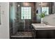 Stylish bathroom boasts a glass-enclosed shower, modern fixtures, and unique tile design at 1362 Briarcliff Ne Rd, Atlanta, GA 30306