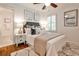 Comfortable bedroom with a cozy bed, stylish decor, a ceiling fan, and ample natural light at 1362 Briarcliff Ne Rd, Atlanta, GA 30306