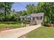 Charming home with a well-manicured front yard, a driveway and mature trees at 1362 Briarcliff Ne Rd, Atlanta, GA 30306