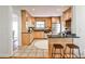 Spacious kitchen features wood cabinets, granite countertops and bar stool seating at the breakfast bar at 1362 Briarcliff Ne Rd, Atlanta, GA 30306