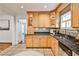 Well-lit kitchen with stainless appliances, wood cabinets, mosaic backsplash, and stylish fixtures at 1362 Briarcliff Ne Rd, Atlanta, GA 30306
