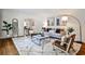 Open-concept living area with hardwood floors, neutral tones, and an inviting view to the dining room at 1362 Briarcliff Ne Rd, Atlanta, GA 30306